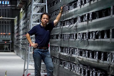 An overview of a large-scale Bitcoin mining farm with rows of mining rigs.